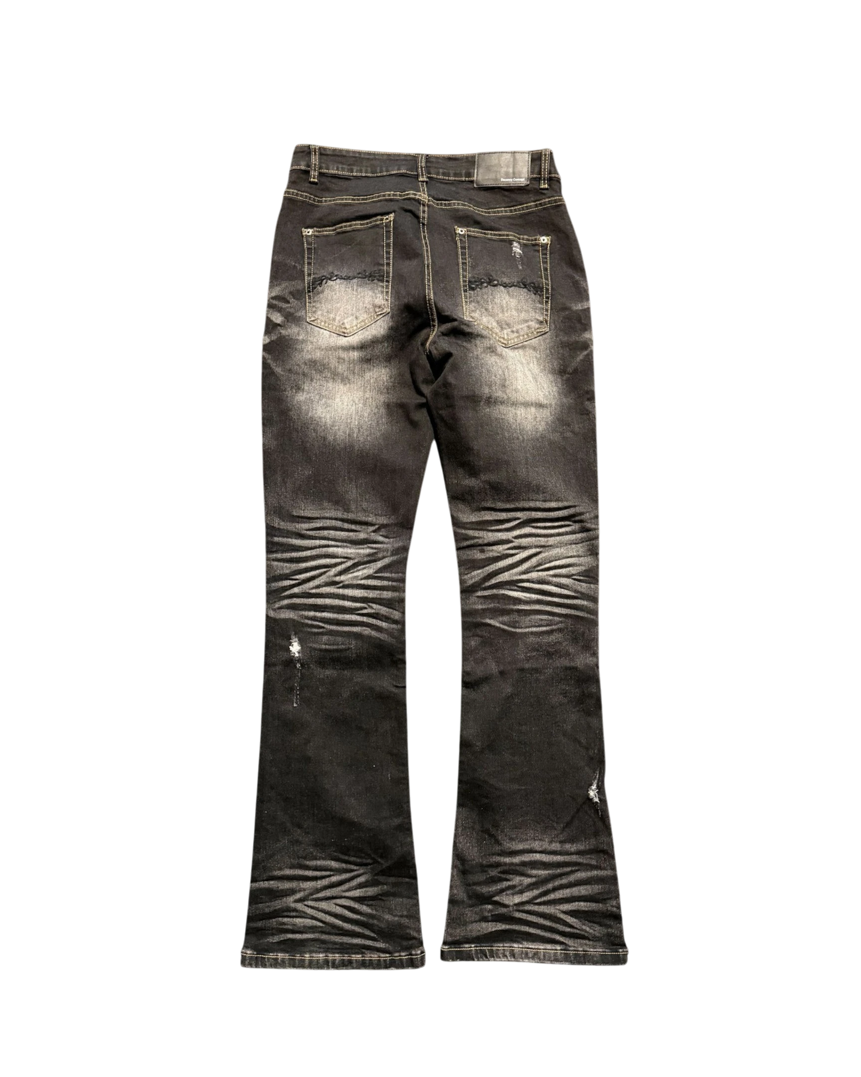 Vicious Cracked Jeans in black stretch denim with a straight flare fit, distressed details, and whiskered texture.