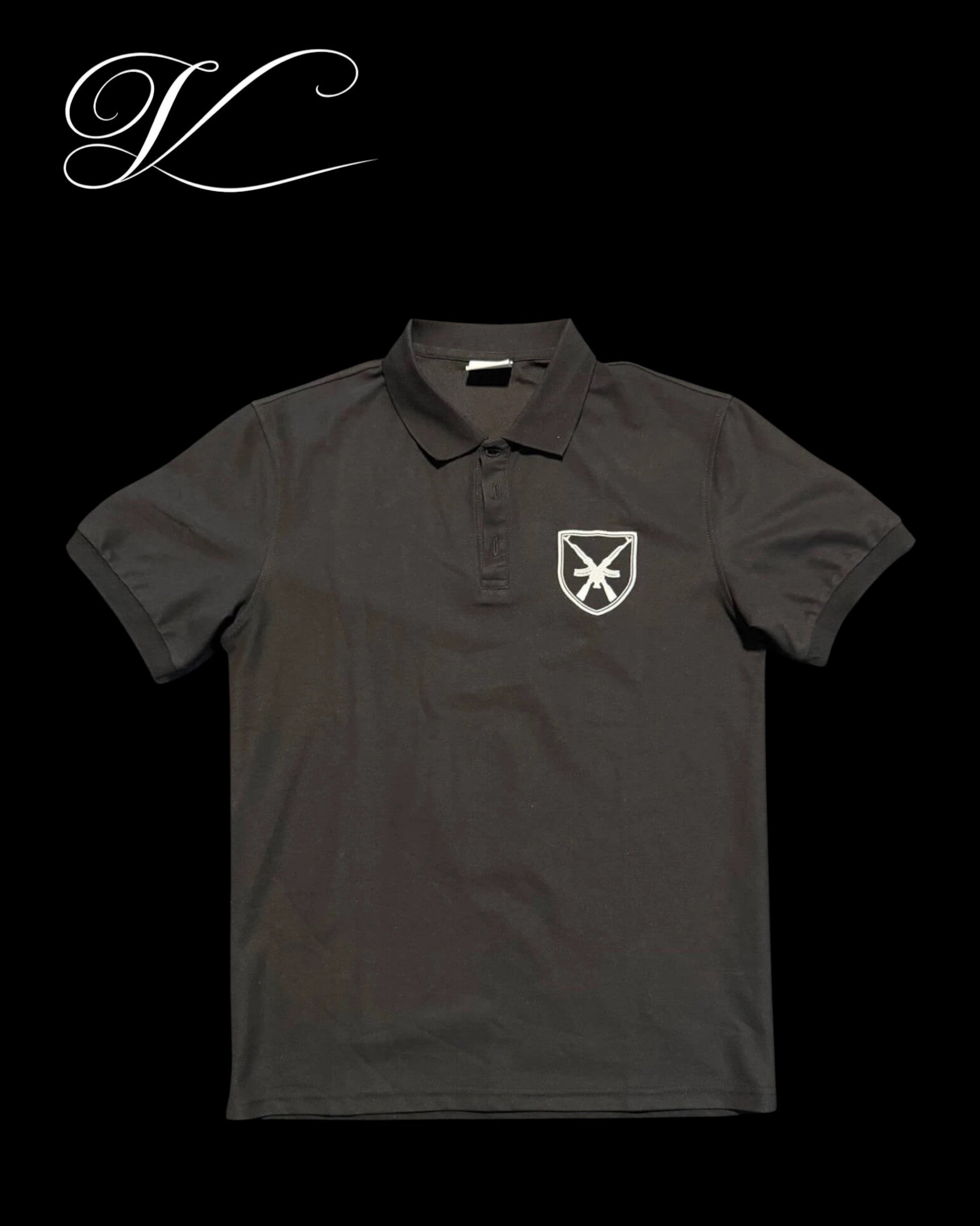 Vicious Crest Polo in black cotton blend with a white embroidered crest and weapon motif on the chest.