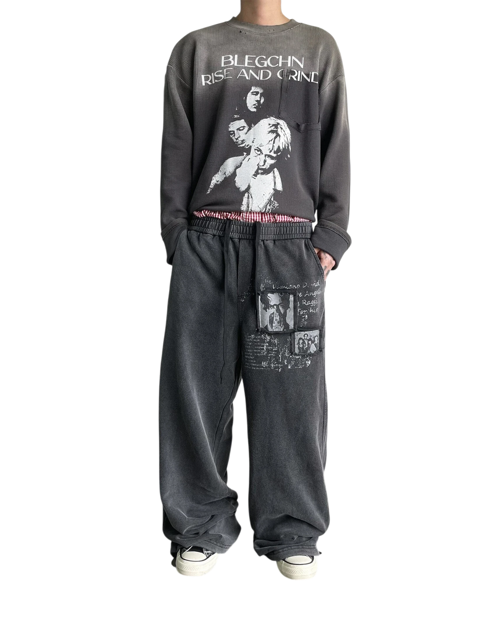 Vicious washed distressed baggy sweatpants with vintage graphic prints and straight-leg fit on a male model