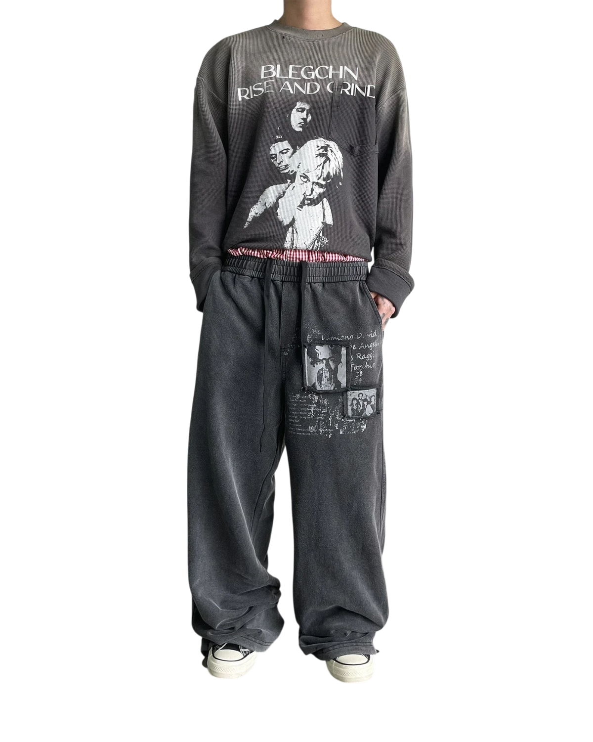 Vicious washed distressed baggy sweatpants with vintage graphic prints and straight-leg fit on a male model