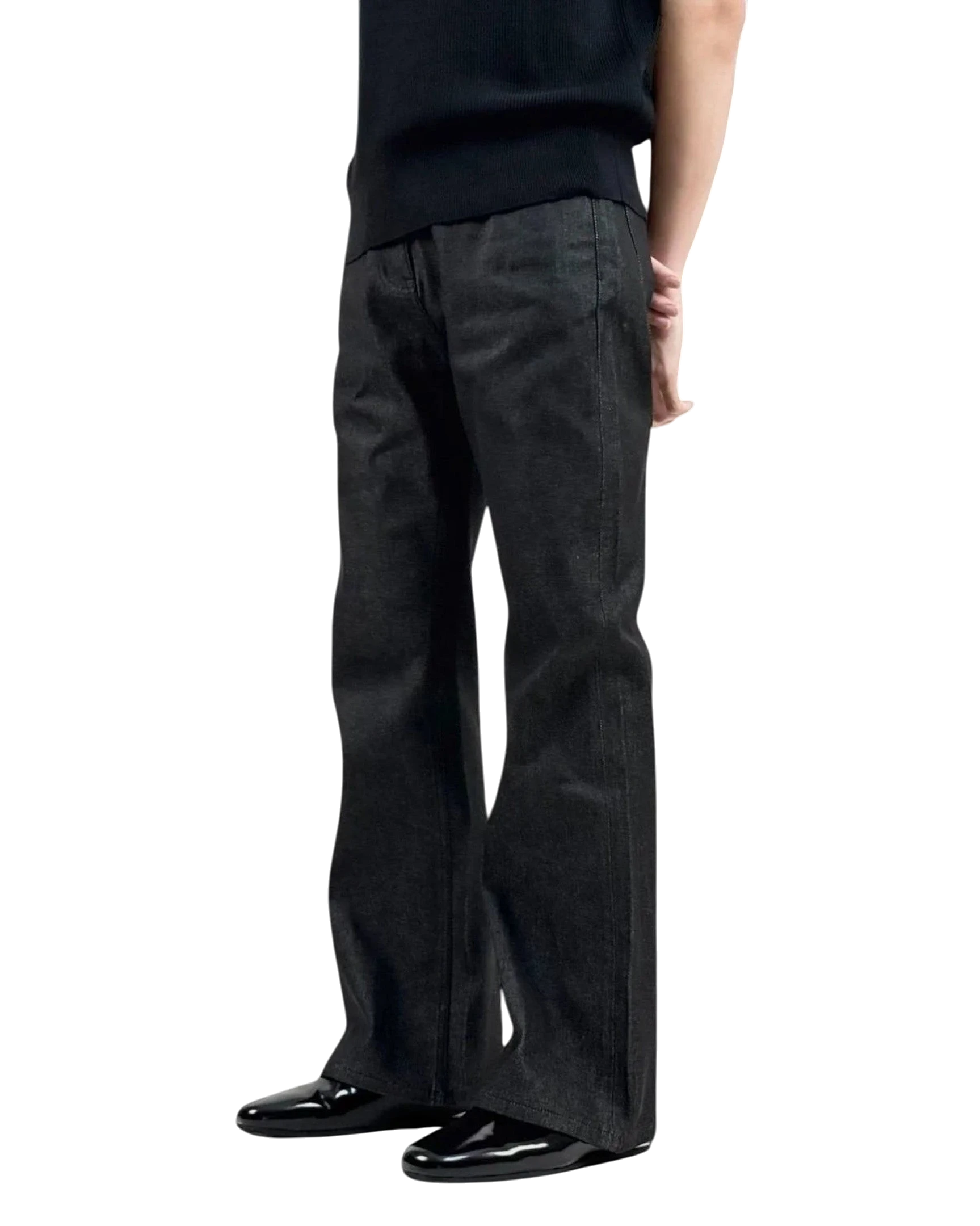 Vicious high-rise raw denim bootcut jeans in black with tonal stitching and five-pocket styling on a model