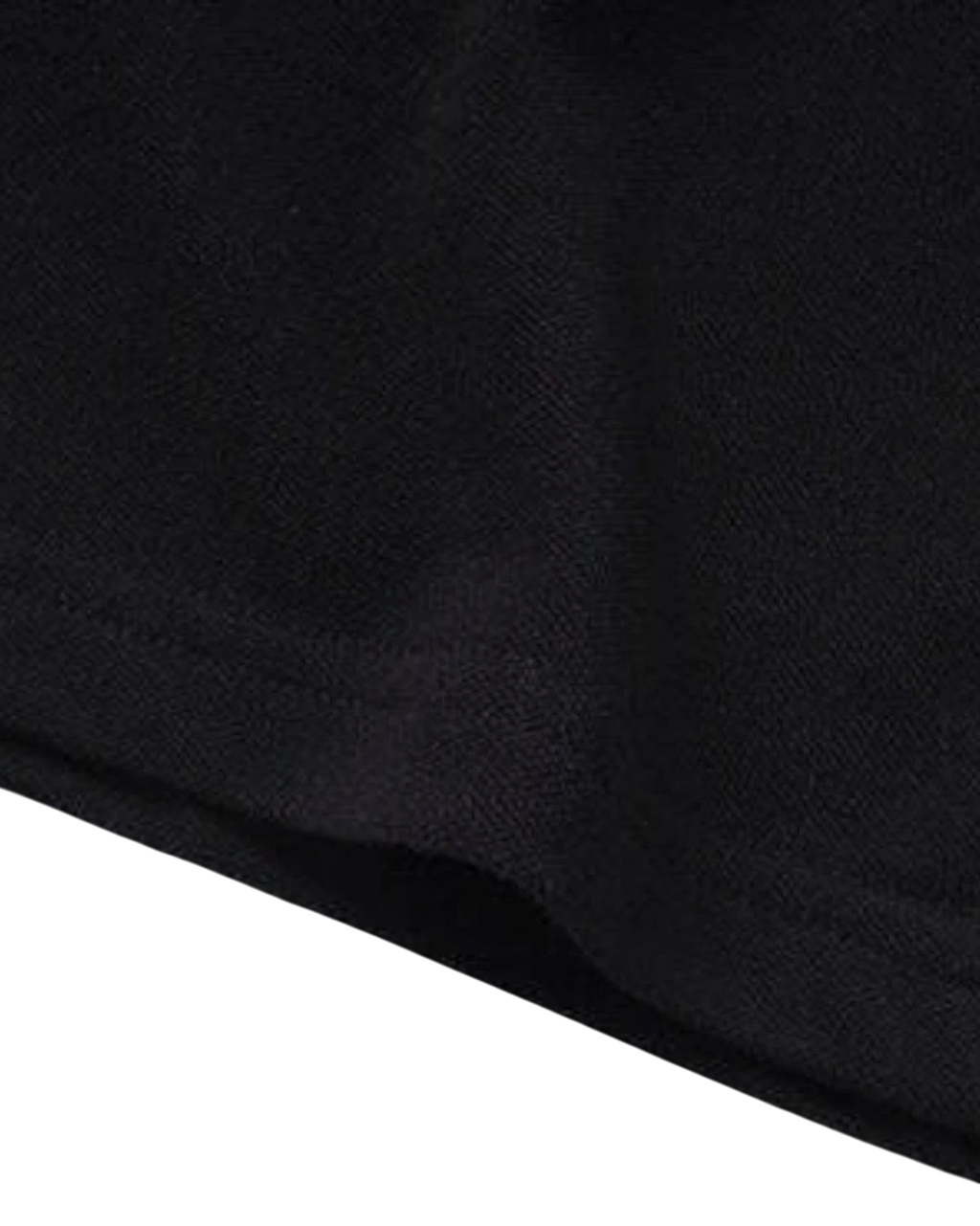 Close-up of the black cotton fabric texture of the Vicious Starlit Polo shirt.