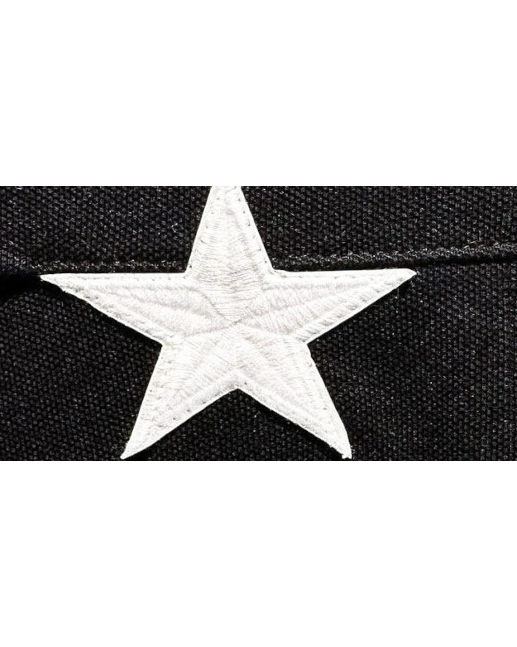 Vicious Starlit Polo featuring a detailed white embroidered star on black cotton fabric.