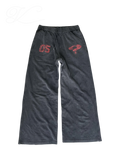 Vicious baggy heavyweight sweatpants in washed black with distressed red graphic prints and a loose straight-leg fit.