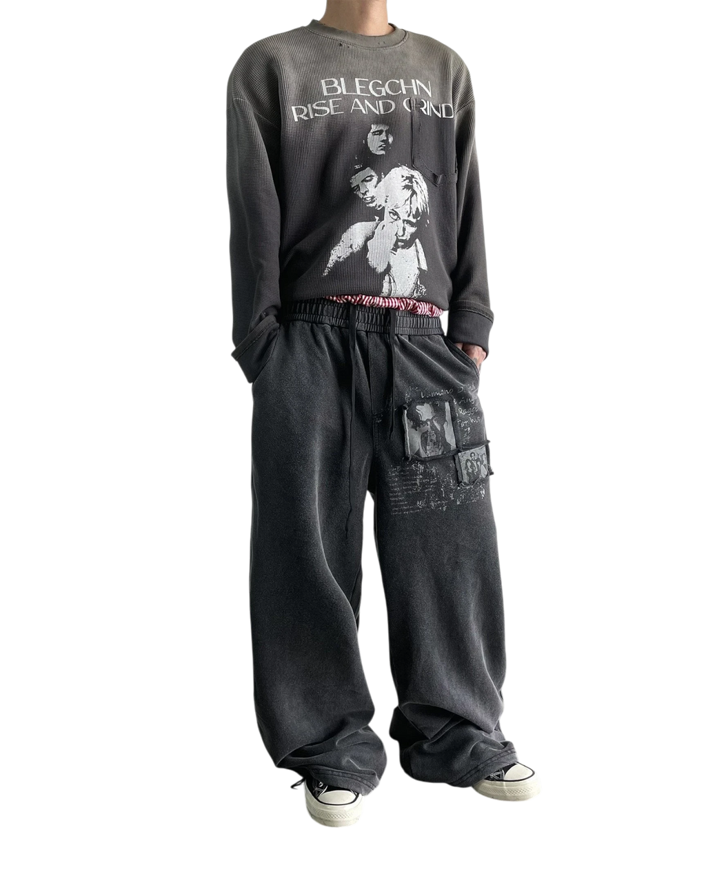 Vicious washed black distressed baggy sweatpants with vintage graphic prints and a relaxed straight-leg fit
