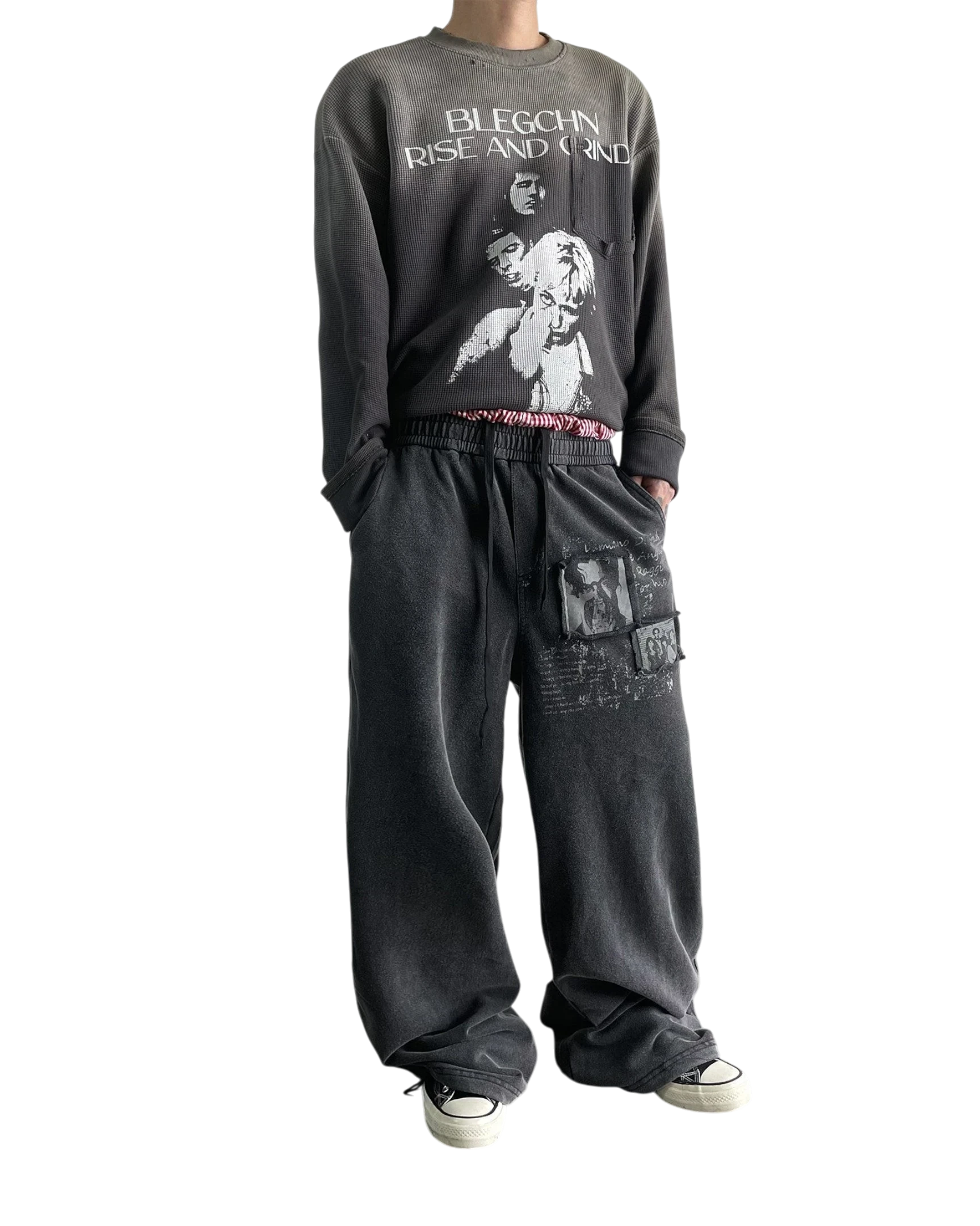 Vicious washed black distressed baggy sweatpants with vintage graphic prints and a relaxed straight-leg fit