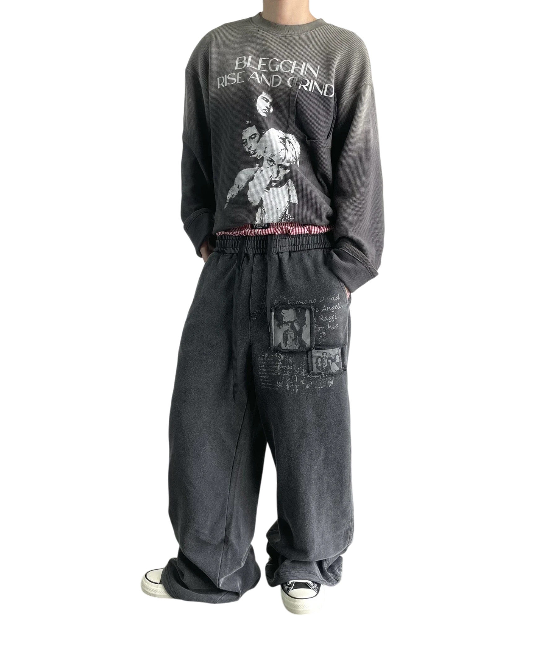 Vicious washed black distressed baggy sweatpants with vintage graphic patches and straight-leg fit